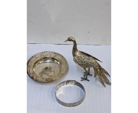 A mid 20th century silver Armada dish hallmarked London 1967, together with a silver bangle 73.2g, and a model of a bird Loca