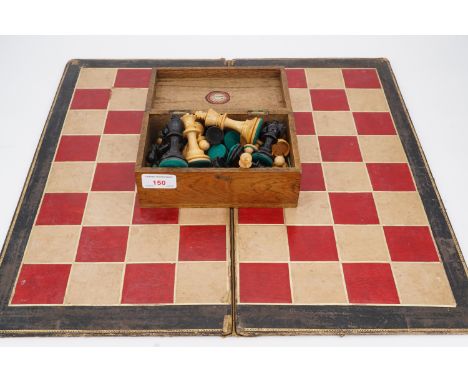 An early 20th Century Staunton type chess set, Kings 8 cm, together with a tooled-leather folding chess board, 50 cm