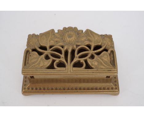 An Art Nouveau cast brass postage stamps box