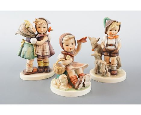 Three Hummel figurines, tallest 14 cm