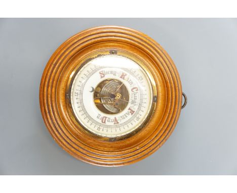 An oak barometer, 20 cm diameter