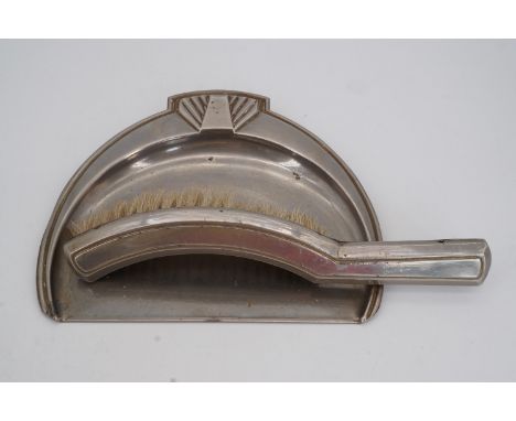 An Art Deco style electroplate crumb tray and brush