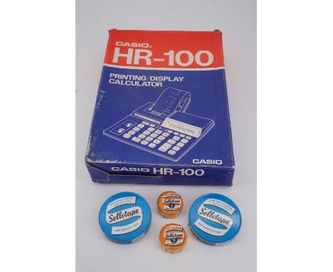 A retro Casio HR-100 printing / display calculator in original packaging, together with new-old-stock Cellotape