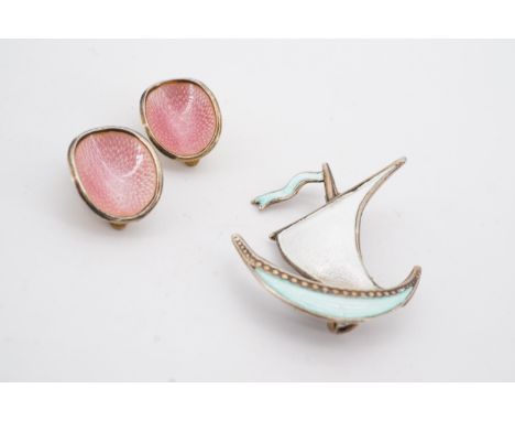 A pair of Norwegian enamelled white metal clip earrings, each of concave oval form, pink basse taille enamelled over a radial