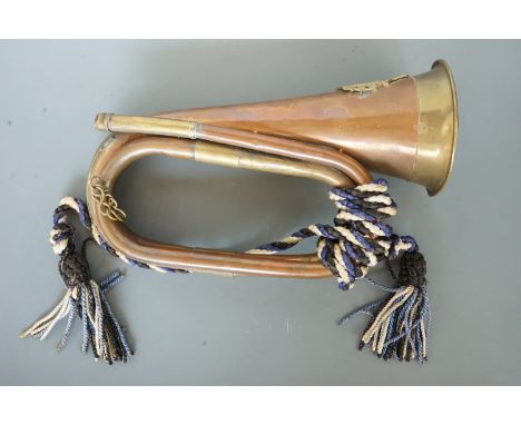 A brass bugle bearing an Ontario Regiment badge