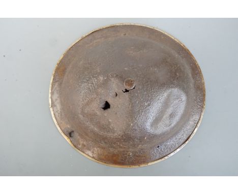 A relic battle-damaged British Mk 2 helmet shell with Normandy provenance