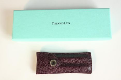 A Tiffany and Co blue lacquered body with intricate silver design purse pen with sleeve cover and box. Tiffany marked on pen 