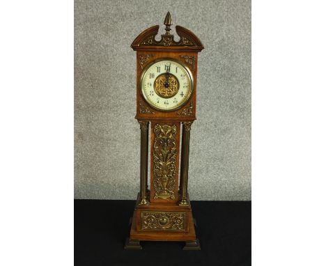 A Victorian miniature longcase clock with brass detailing and enamel dial. With key. H.46cm. 