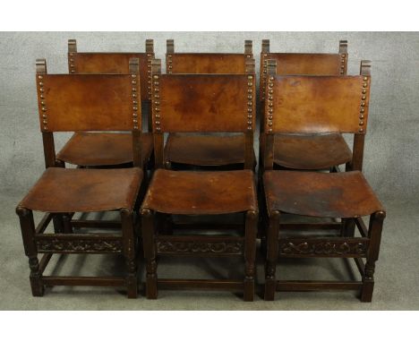 Dining chairs, a set of six vintage oak with leather backs and seats in the Jacobean style. 
