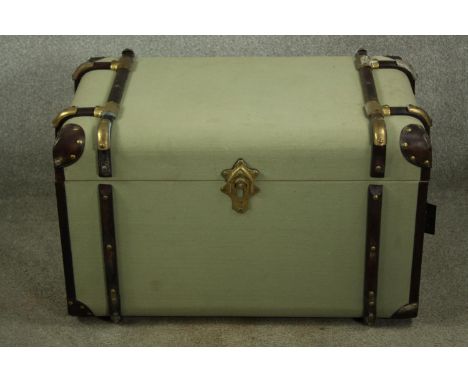 A vintage style travelling trunk with leather and wood bindings. H.48 W.78cm. 