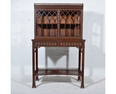 Chippendale style mahogany cabinet, pierced and fretted frieze, the glazed superstructure with Gothic arched spaces, above a 