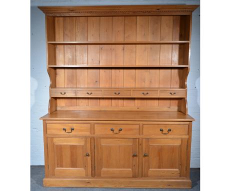 Large modern pine kitchen dresser, the high back with three shelves, the lower shelf fitted with five frieze drawers, on rect