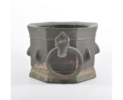 Islamic bronze mortar, octagonal form, applied with a single handle, 20.5cm diam.