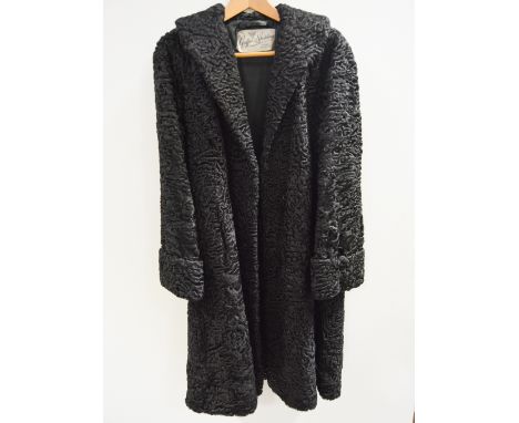 A full length Persian lamb astrakhan coat