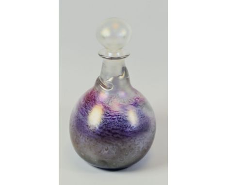 A PETER TYSOE ART GLASS DECANTER with stopper, having a mottled glass effect body and torn effect neck, signed and dated '78,