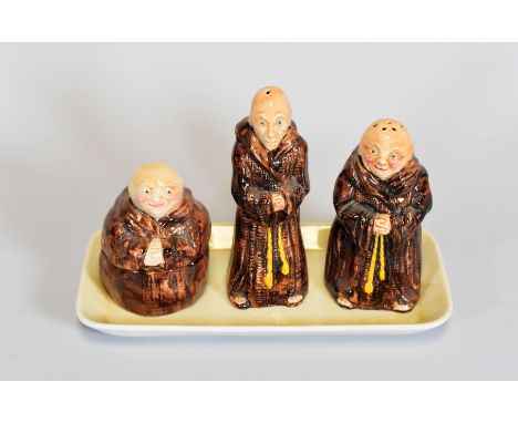 A CARLTONWARE NOVELTY CRUET SET IN THE FORM OF THREE MONKS on a conforming dish, impressed 2845 and printed CarltonWare