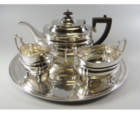 A FOUR PIECE SILVER TEASET FOR TIFFANY comprising teapot, sugar basin, cream jug and circular tray, each with engraved monogr