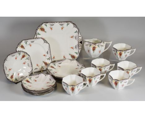 A SHELLEY 20 PIECE TEA-SET floral decorated with chocolate rim, comprising serving plate, six tea-plates and six cups and sau