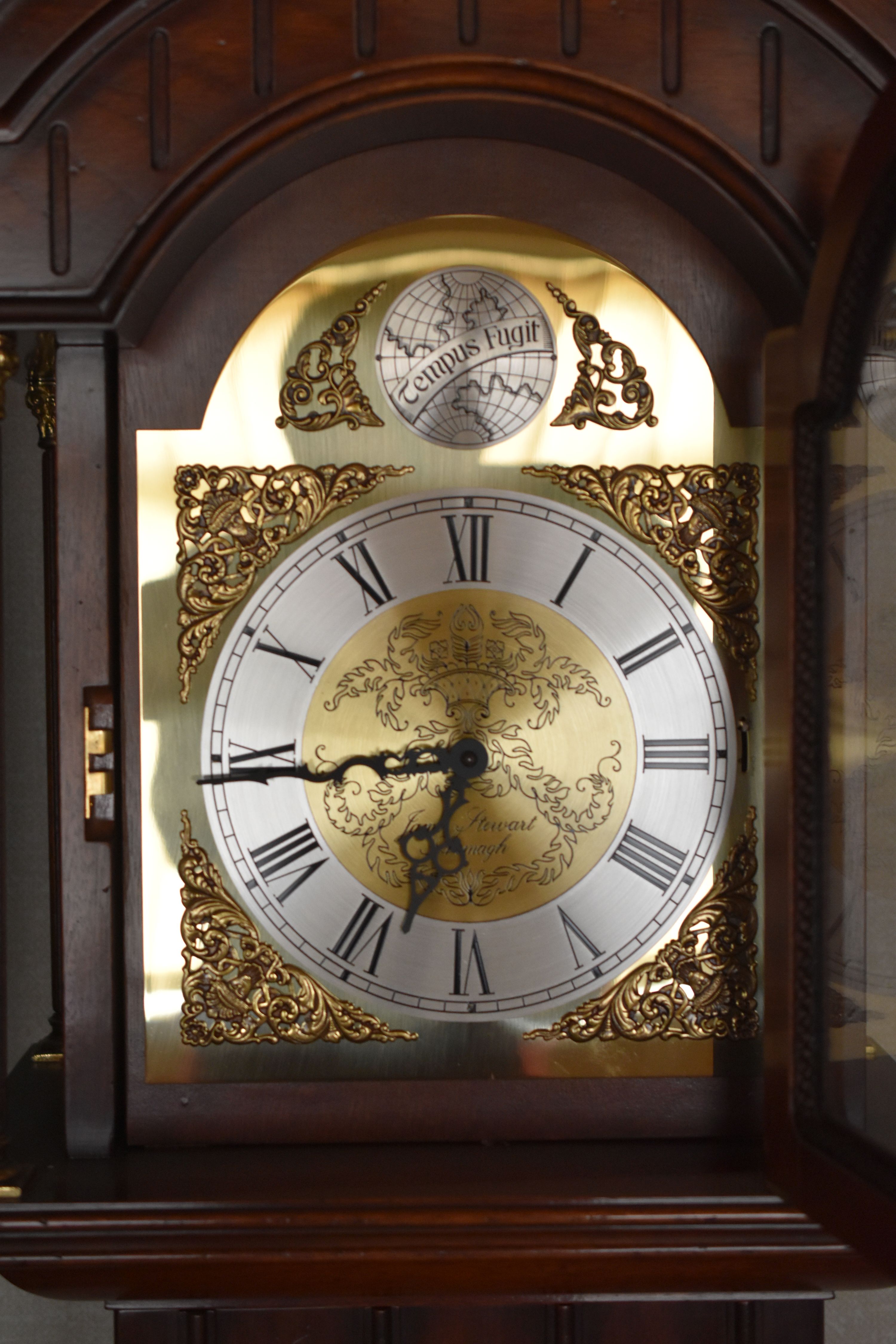 A REPRODUCTION GRANDMOTHER CLOCK BY JAMES STEWART & SONS with glazed