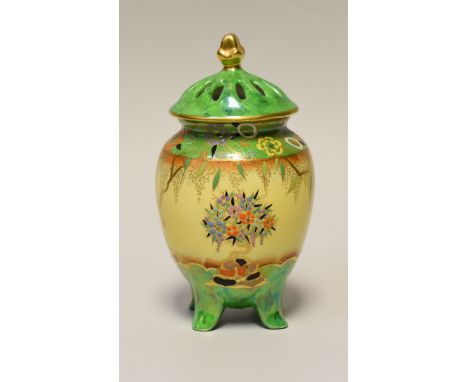 A CARLTONWARE 'MANDARIN TREE' POT-POURRI VASE & COVER of ovoid form on four feet and decorated to a green and yellow reserve 