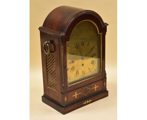 A GEORGE IV TWIN FUSEE BRACKET CLOCK chiming on bells, the case in brass inlaid rosewood and the arched dial in brass with Ro