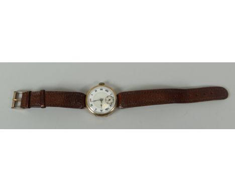 A VINTAGE 9CT GOLD ENCASED WRISTWATCH on later tan leather strap, the dial with Roman numerals and seconds subsidiary dial