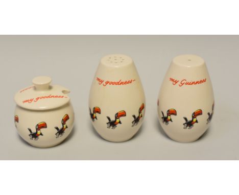 A CARLTONWARE GUINNESS ADVERTISING TRIO of salt pot, pepperette and lidded mustard-pot each in matching white glaze with touc