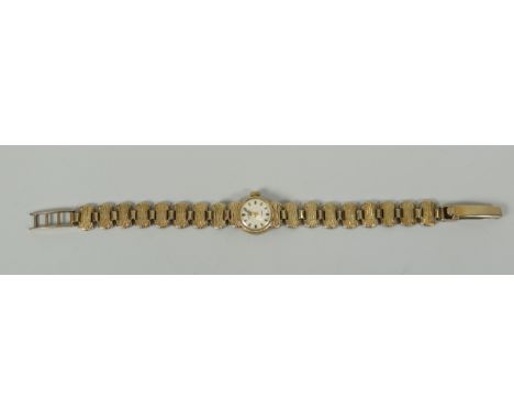 A 9CT YELLOW GOLD LADIES BRACELET WATCH BY ROTARY '21 JEWELS' with winding mechanism on a textured link bracelet, 14gms
