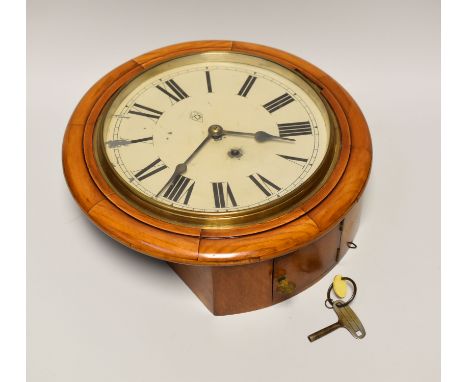 A VINTAGE SCHOOL ROOM TYPE WALL CLOCK in light oak circular encasing with enamel dial bearing Roman numerals and behind glass