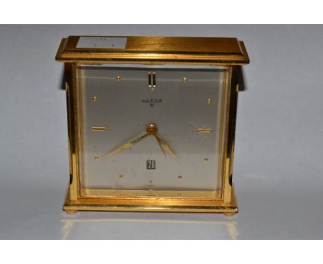 A Luxor alarm clock, silvered dial, boxed