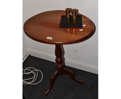 A Victorian mahogany drop top table, oval top, cannon barrel support, tripod feet