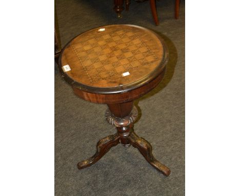 A Victorian chess top work table, hinge lid, fitted interior, tapering octagonal column, carved tripod feet c.1880