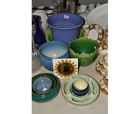 A Bretby jardiniere, glazed in varying tones of purple, impressed marks; a Portland Art Nouveau jardiniere, moulded in low re