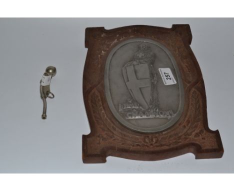 Naval Interest - a military issue Bosun's whistle, issue arrows to bowl;  a HMS Champion cast pewter shield, carved wooden su