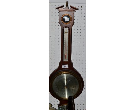 A 20th century mahogany banjo barometer, the silvered circular dial inscribed Comitti of London, moulded pediment with gilt b