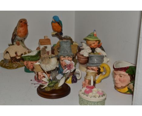 Ceramics - a Goebel model of a robin, blue printed marks; a Goebel figure of a boy and rabbits; a Lilliput Lane model, Miller