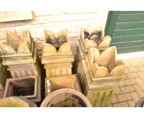 Architectural Salvage - a set of four reconstituted stone chimney pots, shaped quarter tops, inset decoration, (4)
