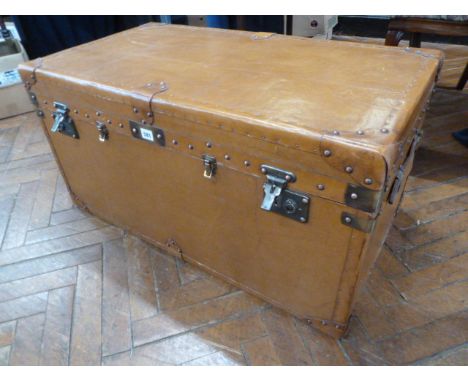 Tan leather covered trunk 