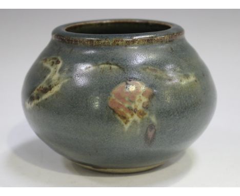 A Bernard Leach St Ives studio pottery vase of bulbous shape, covered in a blue/grey glaze decorated with opposing stylized f