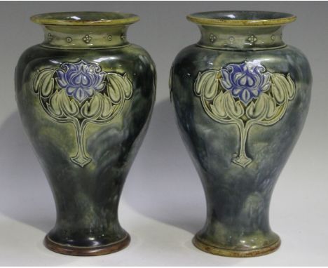 A pair of Royal Doulton stoneware Art Nouveau vases, early 20th century, the mottled green glazed baluster bodies each with t