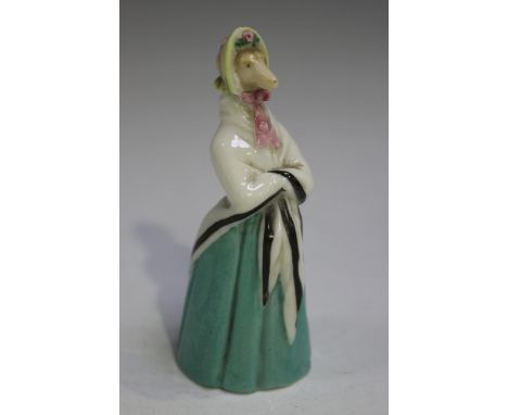 A rare Worcester porcelain candle snuffer, modelled as a greyhound, circa 1860, the standing animal wearing a green skirt, bl