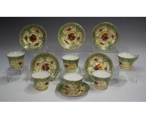 A set of six Royal Worcester floral decorated coffee cups and saucers, circa 1930 and 1931, decorated with floral sprays and 