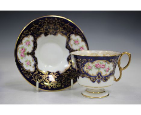 A set of six cased Crown Staffordshire coffee cups and saucers, early 20th century, decorated with panels of pink roses again