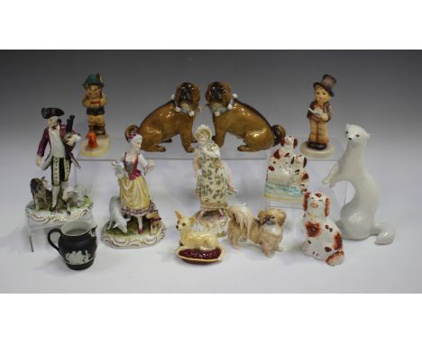 A pair of Continental porcelain Meissen style models of pug dogs, late 19th century, typically modelled seated on their haunc