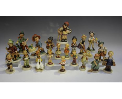 Thirteen Goebel Hummel figures, including four Hummel Club editions, together with a similar Goebel figure of a boy playing a