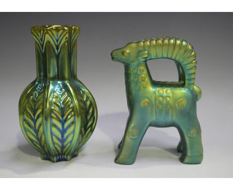 Two pieces of Zsolnay Pécs with Eosin lustre glazes, 1930s, the first modelled as a standing ibex, designed by Judit Nador, h