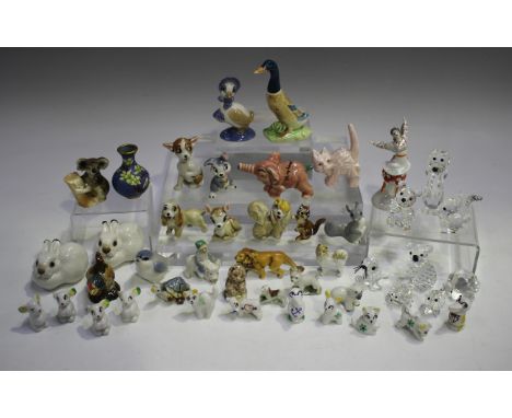 A mixed group of small mostly ceramic and crystal ornaments, late 19th/20th century, including eleven Wade Minikins, two Wade