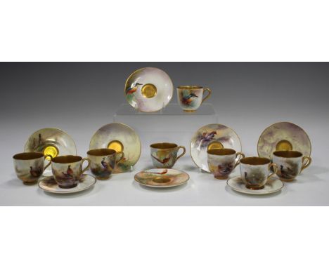 Eight assorted gilt lined Royal Worcester cabinet cups and saucers, 1919 to 1930, comprising an example painted with a kingfi