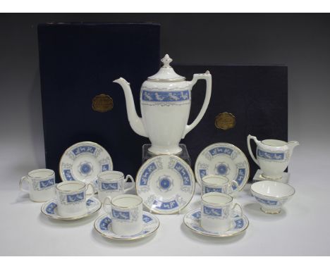 A Coalport Revelry part coffee service, comprising coffee pot and cover, milk jug, sugar bowl and six coffee cans and saucers