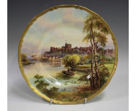 A Royal Worcester porcelain plate, mid-20th century, painted by Raymond Rushton, signed, depicting a riverside scene of Winds